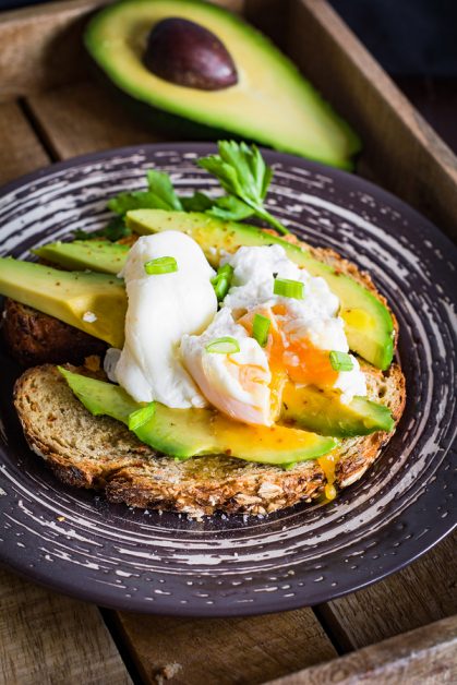Avocado and poached egg toast. Healthy breakfast